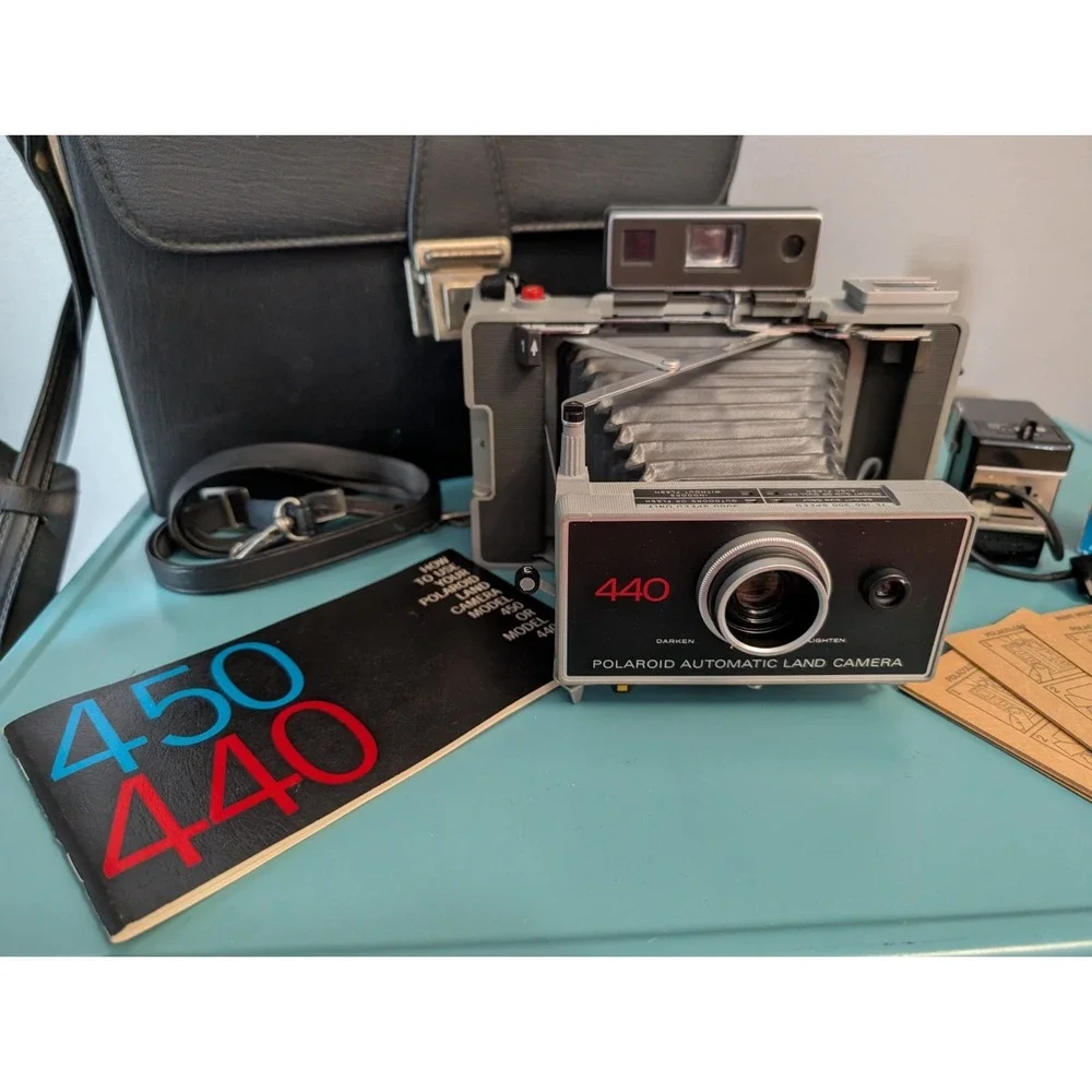 Vintage Polaroid 440 Automatic Land Camera with Strap, Case, Film, and Xtra Bulb
